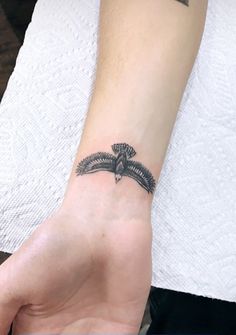 a person with a small tattoo on their wrist