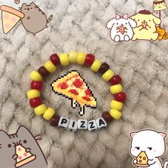 a bunch of different items that are on a bed with the word pizza spelled in small letters