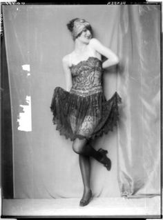 an old photo of a woman in a dress