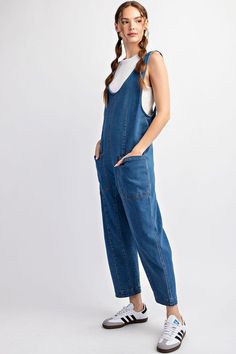 Mineral washed solid sleeveless jumpsuit featuring adjustable straps, a scoop neckline, two open front pockets and is a straight leg style. Model is 5'9" and wearing a small.75%COTTON 23%POLYESTER 2%SPANDEX Spring Medium Wash Overalls With Adjustable Straps, Blue Overalls With Adjustable Straps For Spring, Spring Blue Overalls With Adjustable Straps, Casual Dark Wash Bib Front Overalls, Spring Overalls With Slip Pockets And Relaxed Fit, Casual Sleeveless Shortalls With Pockets, Casual Spring Jumpsuits And Rompers With Adjustable Straps, Spring Casual Jumpsuits And Rompers With Adjustable Straps, Casual Jumpsuits And Rompers With Adjustable Straps For Spring