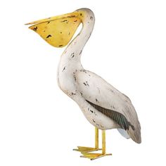 a pelican with a yellow beak is standing on its legs and has it's head turned to the side