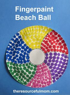 a paper plate with different colored dots on it and the words fingerpaint beach ball