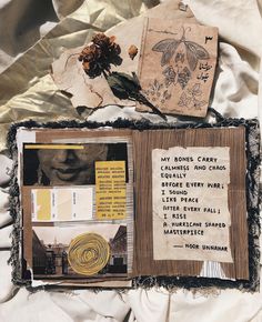 an altered collage with papers and other things on top of the sheeted paper