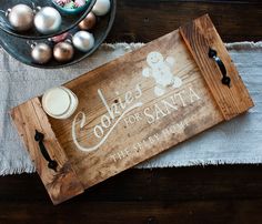 a wooden sign sitting on top of a table next to some eggs and other decorations