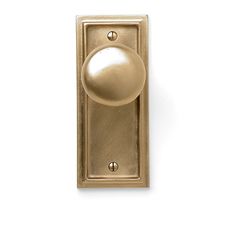 an antique brass door knob on a white background