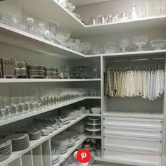 the shelves are filled with dishes and glasses