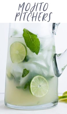 mojito pitcher with limes and mint garnish on the rim next to it