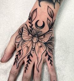 a person's hand with a tattoo on it