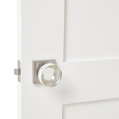 an open door with a glass knob on it