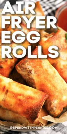 air fryer egg rolls on a plate with ketchup