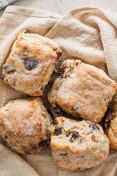 blueberry muffins are piled on top of each other