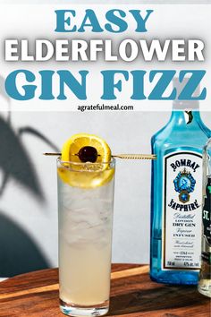 an easy elderflower gin fizz recipe is served in a tall glass with a lemon slice on the rim