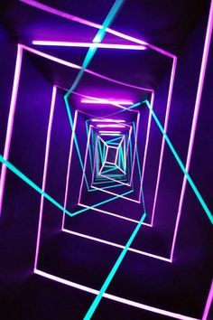 an abstract photo with neon lights in the center and blue lines going through it to create a tunnel