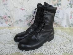 Black Leather army combat boots. These lace up the front with quick laces and have padded ankles. The ankles are marked with 8-93, which I believe means these were made in August 1993. The soles are marked with the size and Ro-search. The leather has some wear here are there, such as creasing, scuffs and marks (see close ups), but overall the boots look good and are ready to wear! Some slight wear on heels and some dirt on the soles but overall they look good.  Size marked: Men's 8 1/2 Wide -- see measurements to ensure fit. Would be equivalent to somewhere around a Women's 10 1/2 Wide.  Measurements are in inches.  Length of insole: 10 3/4 Width at ball of foot: 3 3/4 Rise, sole to top of boot: 9 1/2 Follow @lunarhovel on instagram for new items posted every week and sale announcements! I Army Combat Boots, Jungle Boots, Boots Tall, Grunge Punk, Goth Grunge, Work Boots, Vintage Clothing, Combat Boots, Vintage Outfits