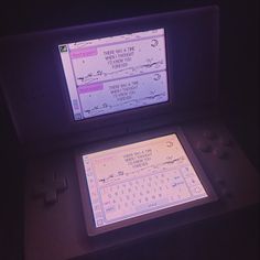 an electronic device sitting on top of a table next to a computer keyboard and mouse