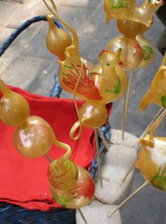 some yellow and red items on sticks in a basket