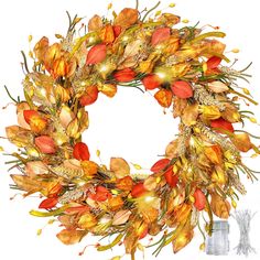 a wreath with orange and yellow flowers on it