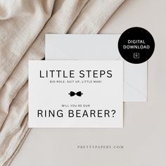 there is a card with the words little steps ring bearer on it next to an envelope