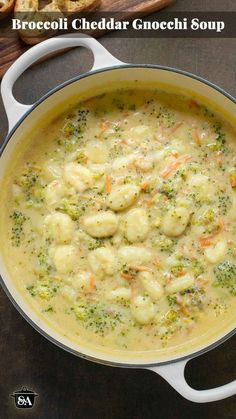 broccoli cheddar gnocchi soup in a pot with bread on the side