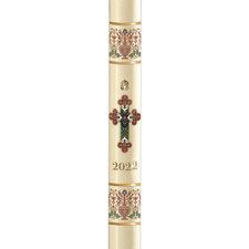 a tall candle with an ornate cross on the front and sides, decorated with flowers