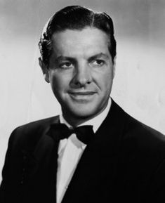 a man in a tuxedo and bow tie