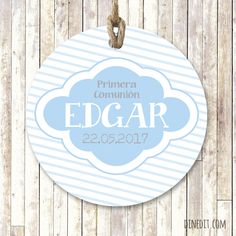 a round ornament hanging on a wooden wall with the name edgarr