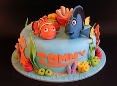 there is a cake decorated with an image of clown fish and nemo on it