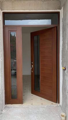 an open wooden door on the side of a building