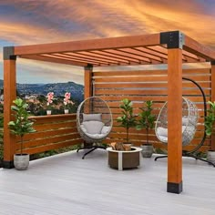 an outdoor deck with hanging chairs and a hammock chair on the back patio