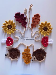 crocheted hedges and sunflowers are arranged in a circle