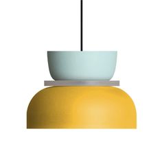 a yellow and white light fixture with a black cord hanging from it's end