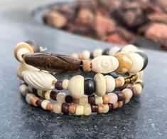 Fall boho bracelet, wood beads creams and browns. Wire wrap so easy to use fits petite and medium sized wrists! Stretch Beaded Bracelets Diy, Wire Wrap Bracelet, Bracelets Diy, Wire Wrapped Bracelet, Handmade Wire Wrapped, Boho Fall, Boho Bracelet, Beaded Bracelets Diy, Boho Bracelets