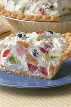 a slice of fruit and cream pie on a blue plate