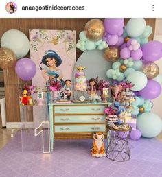 an image of a table with balloons and decorations on it for a princess birthday party