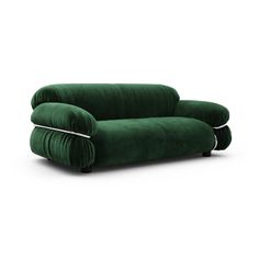 a green couch sitting on top of a white floor