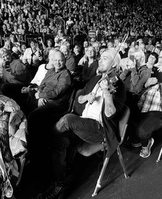 a group of people sitting in front of an audience