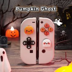 a white refrigerator with halloween decorations on the front and back doors, sitting next to pumpkins