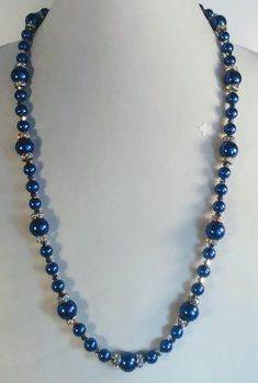 Handcrafted 27 Inch Necklace of Royal Blue Glass Pearls and Rhinestone Spacers There are also tiny silver Bicones between each bead and spacer.  The rhinestones are aurora borealis which add color and sparkle to this beautiful, classy necklace. A silver lobster claw clasp will hold everything secure, and the 2 inch extension chain will give you more length if you prefer it. Buy with confidence!  As with all of my work, your satisfaction is 100% guaranteed!! If you have questions or comments don't hesitate to contact us!  We look forward to hearing from you! Don't forget to check back often to see what is new! Enjoy! Thank you for stopping by! Have a great day! Silver Beaded Necklace With Rhinestones, Silver Beaded Necklaces With Rhinestones, Blue Crystal Beaded Necklaces For Jewelry Making, Silver Crystal Beaded Necklaces With Large Beads, Blue Crystal Jewelry With Polished Beads, Blue Crystal Round Beads, Blue Crystal Round Bead Jewelry, Blue And Silver Beads For Jewelry Making, Blue Crystal Round Beads Jewelry