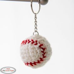 a crocheted ball hanging from a hook