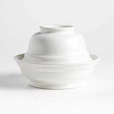 a large white bowl sitting on top of a table