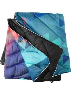 two pieces of colorful quilted material on top of each other, one in blue and the other in pink