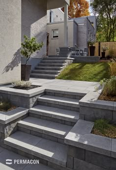 concrete steps lead up to the side of a house