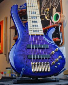 a blue electric guitar sitting on top of a table