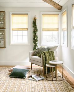 the living room is decorated for christmas with green and gold accents, including garlands