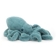 an octopus stuffed animal laying on the ground