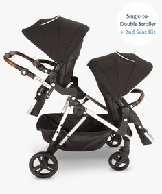 the double stroller has two seats and is black with white trims on it