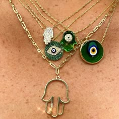 Artful and timeless, the Antique Evil Eye Necklace is imbued with uncommon character. Spend a moment gazing into this glass pendant's swirls of emerald green, indigo, and amber and you're sure to be entranced. Layer with other colorful evil eyes and bold metallics to let the good vibes roll. Or pair with our Antique Evil Eye Earrings for the most original RAGEN combo. 14k gold plated sterling silver 16-18" Adjustable in length Translucent green evil eye charm: .5" in width Handmade and painted i Necklace Combo, Evil Eyes, Evil Eye Earrings, Dope Jewelry, Jewelry Fashion Trends, Jewelry Lookbook, Eye Earrings, Evil Eye Pendant, Evil Eye Charm