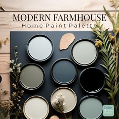 the modern farmhouse home paint palette is displayed on a table with flowers and greenery