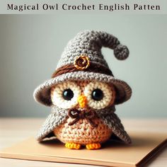 an owl is wearing a crochet hat on top of a wooden board with the words, magic owl crochet english pattern