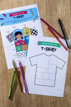 two t - shirt coloring pages with colored pencils next to them on a table